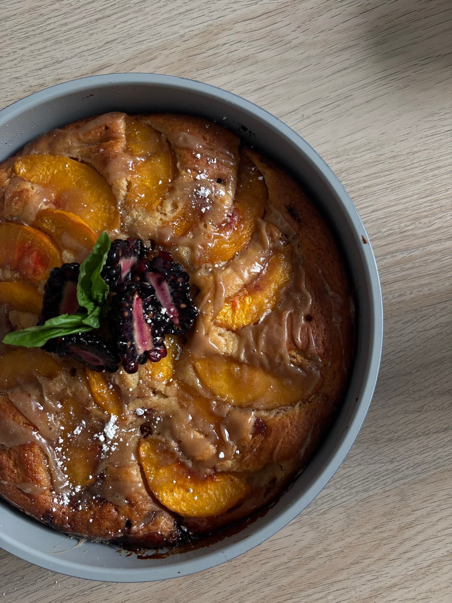 A golden fruit tart with berries, ready to share